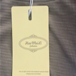 Woman’s olive green top brand new with tags for. Amazon paid $30 new never worn